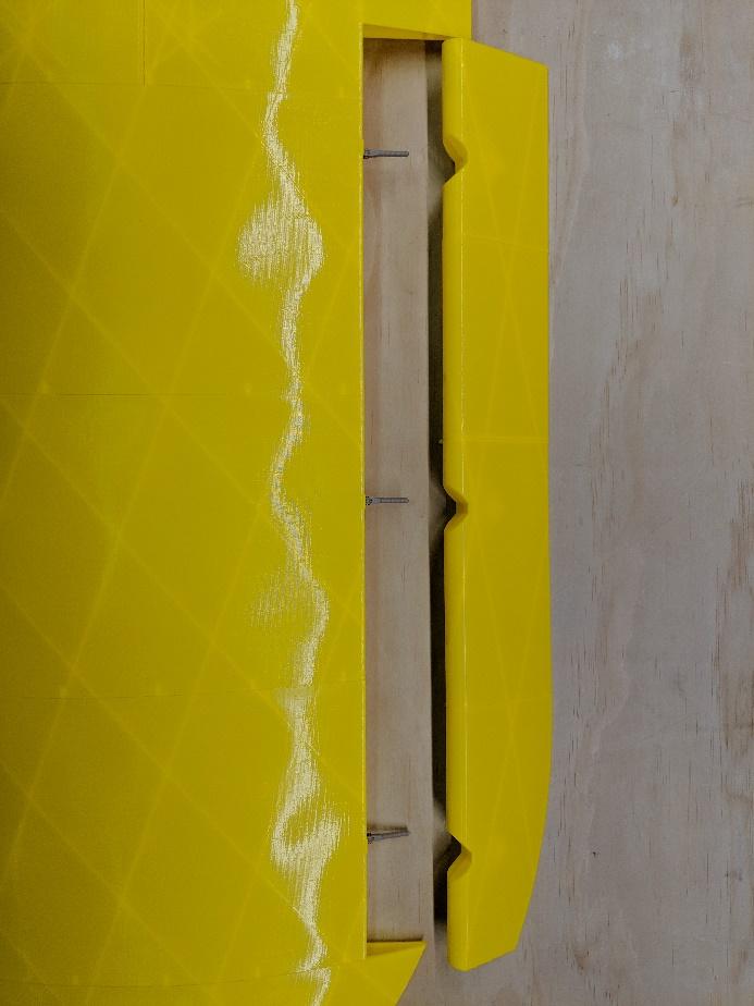 Installing the aileron onto the hinge pins