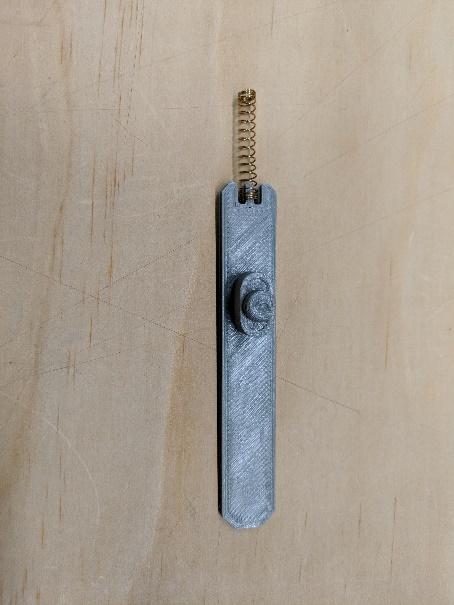 Pen spring on the hatch latch