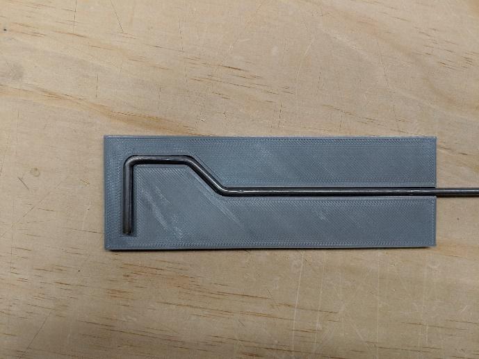 Bending the nose gear rod in a vice