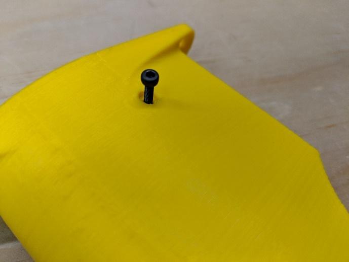 Shock absorber top end aligned with the pylon mount hole