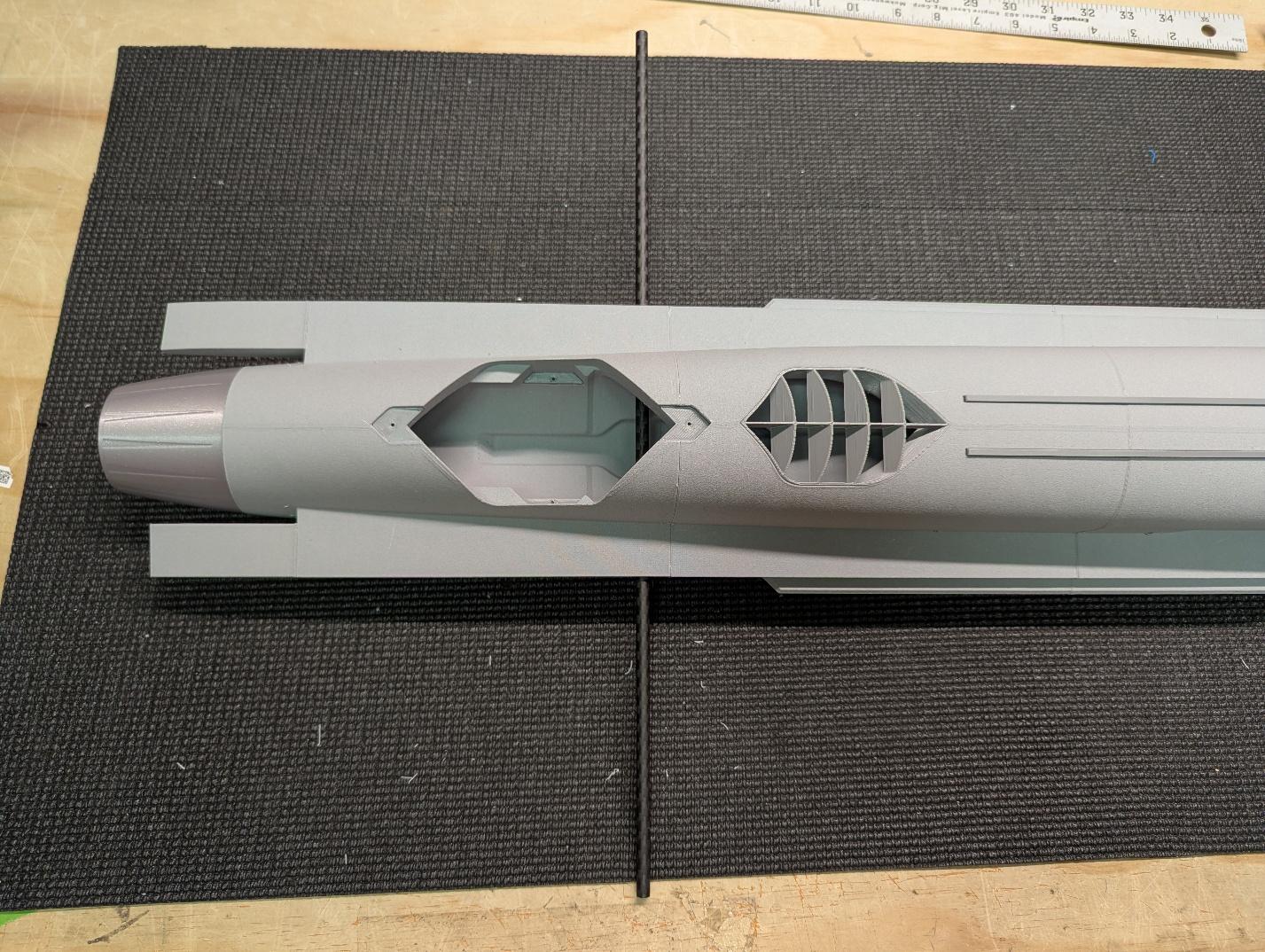 Carbon fiber spar tube slid into the fuselage