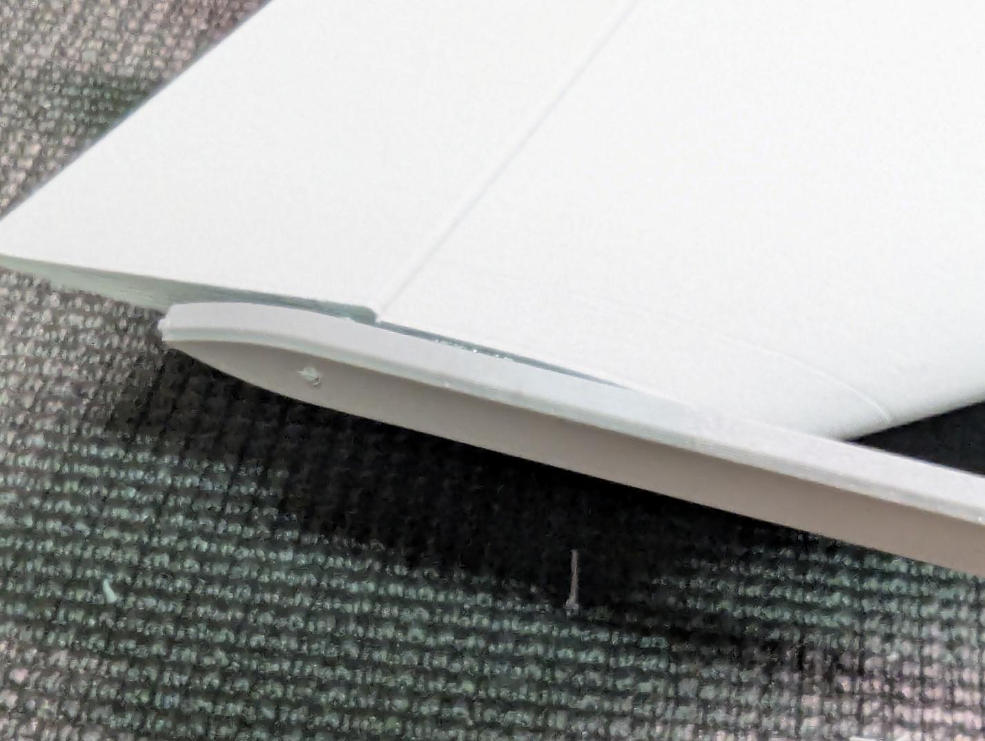 Filament hinge rods trimmed flush with the wingtips