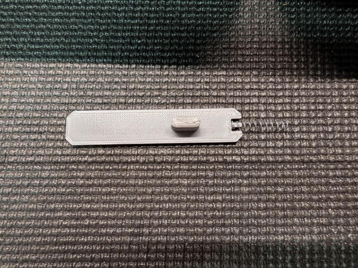 Hatch latch and pen spring placed