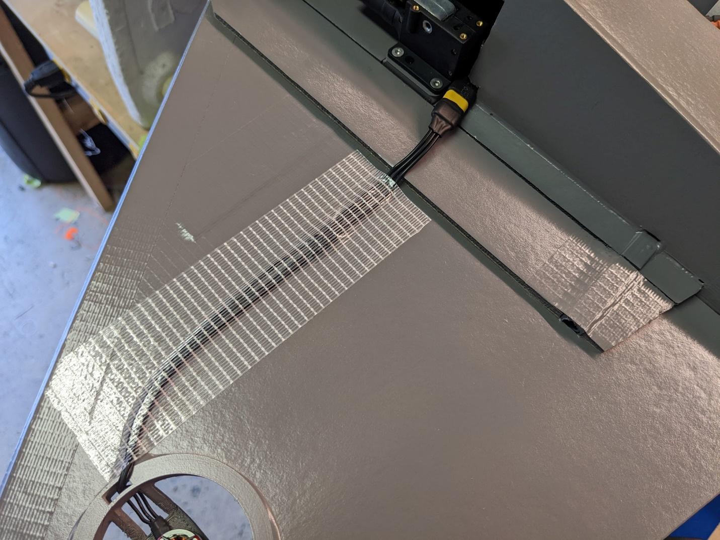 Roll motor leads secured
