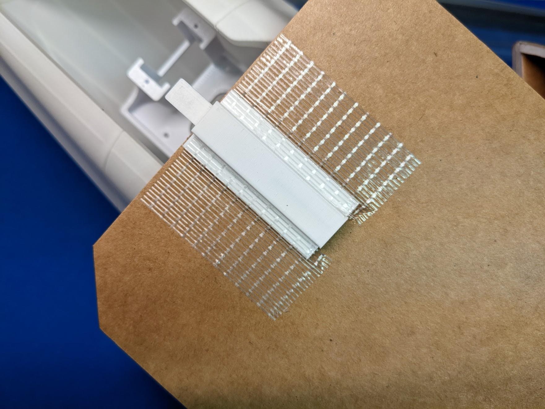 Panel reinforced with tape