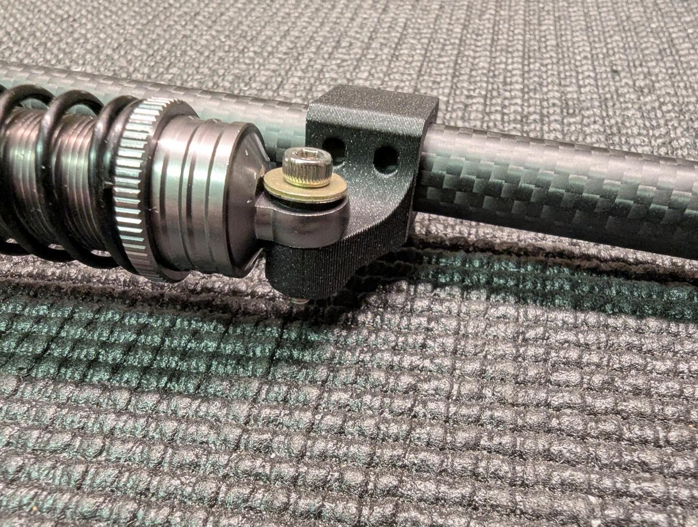 Shock absorber secured to the strut mount