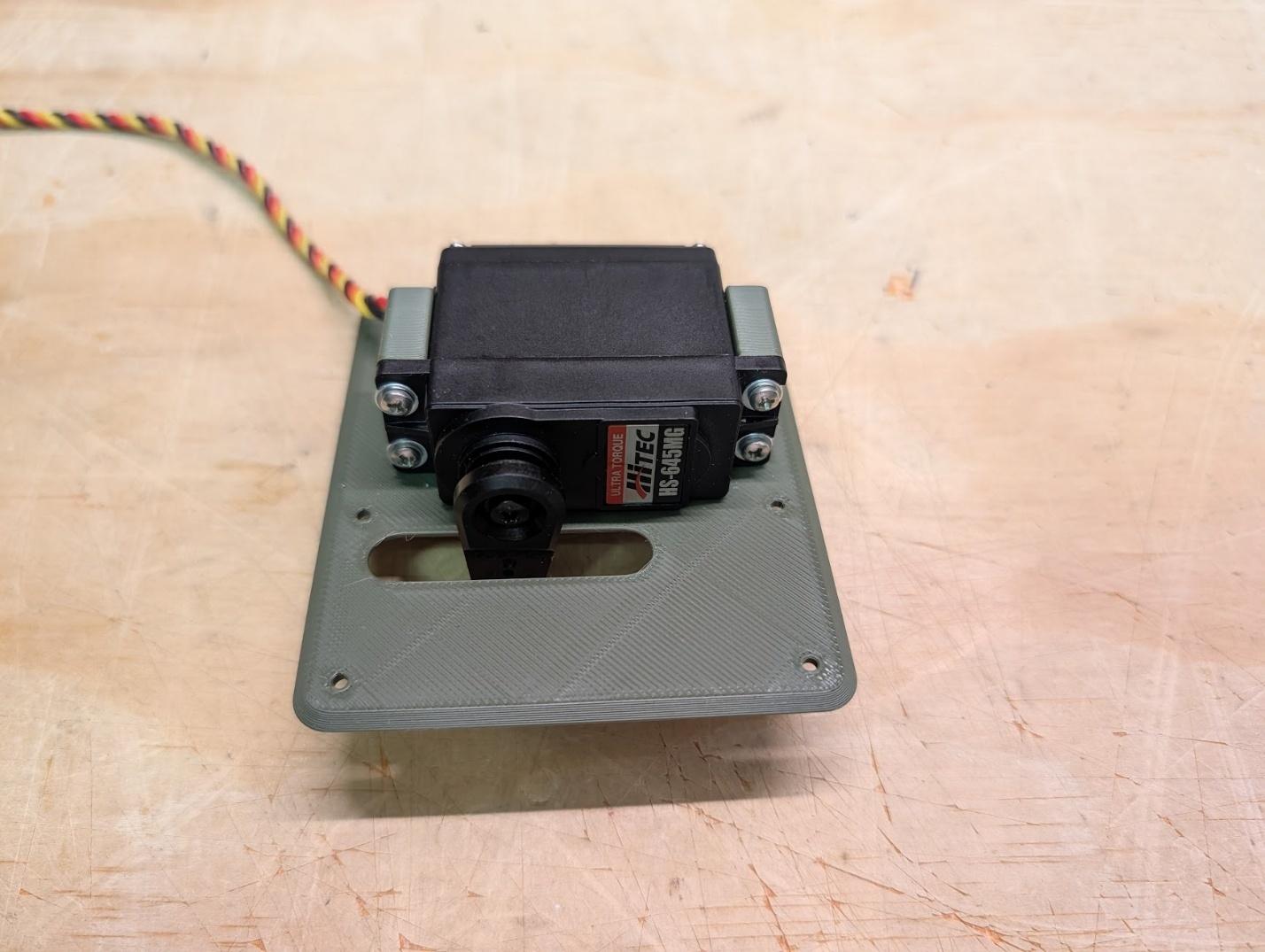 Flap servo secured to its mount