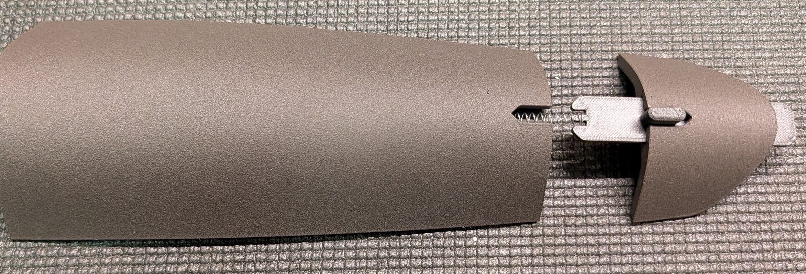 Pen-spring latch fitted between the hatch sections