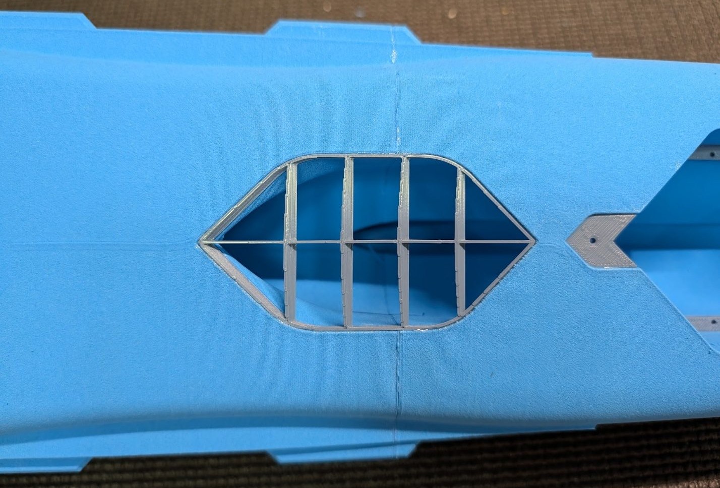 Auxiliary inlet cover on the underside