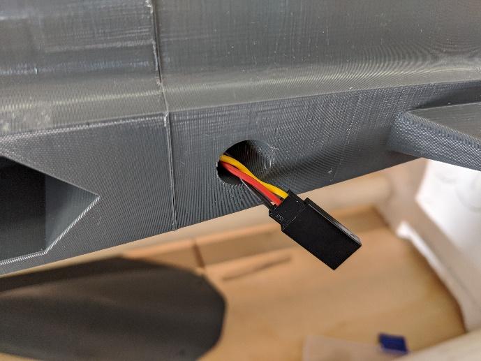 Flaperon servo extensions run through the tubes