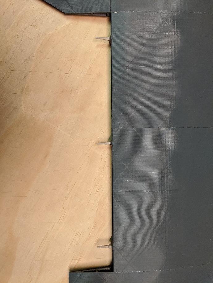 Hinge pins installed in the wing