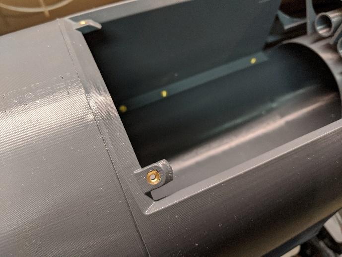 Threaded inserts on the fan hatch mount tabs